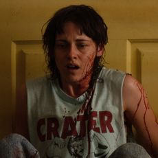 kristen stewart looks shocked covered in blood in the movie love lies bleeding